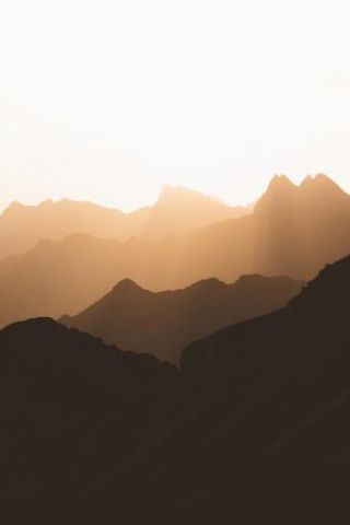 Silhouette Of Mountain Range At Sunrise